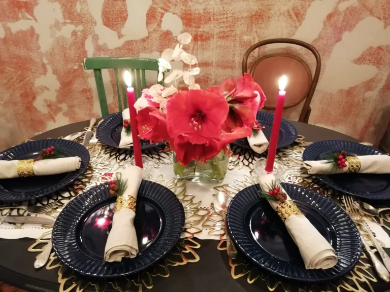 Laid table with red flowers