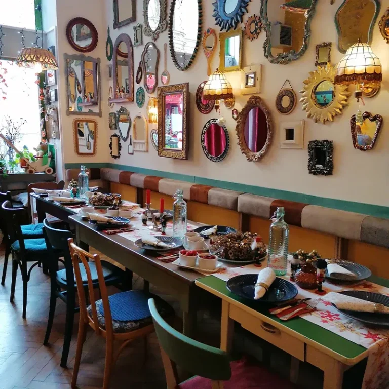 Dining room with mirrors on the wall